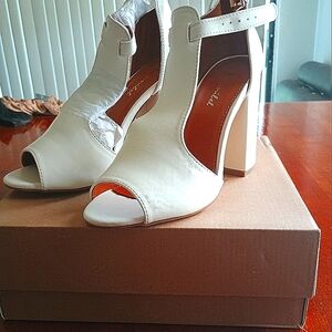 Beautiful white heels and long brown boots each only worn once for sale only $20